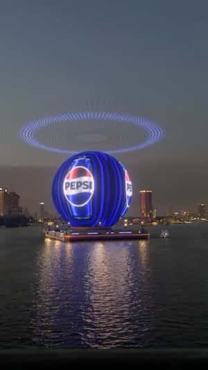 Sphere Digital Screen Display on the River in a fake-out-of-home ad of Pepsi
