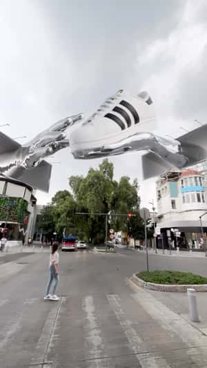 Metal Hand Grabs Sneakers from Digital Screen