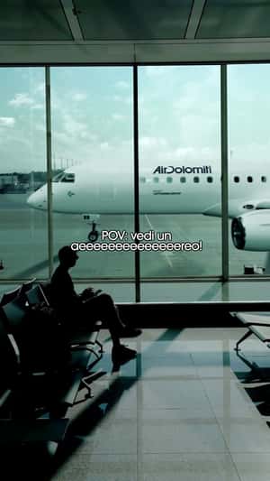 Long Airplane Running at Tarmac in a fake-out-of-home ad of Air Dolomiti