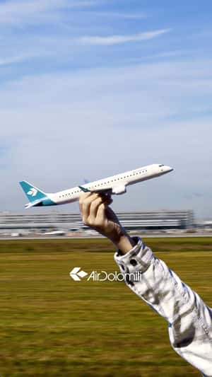 Toy Plane Soars into the Air in a fake-out-of-home ad of Air Dolomiti