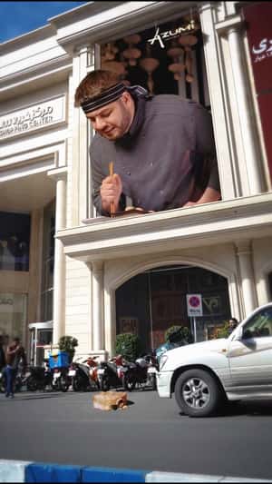 Chef Drops Sushi on Street in a fake-out-of-home ad of Azumi.ir