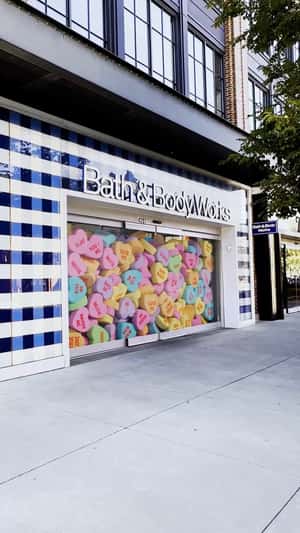 Heart Candies Overflow in a fake-out-of-home ad of Bath & Body Works