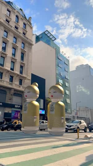 Perfume Bottles Strolling on Street in a fake-out-of-home ad of Benetton Perfume