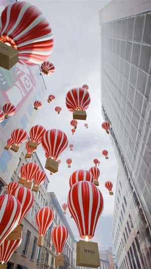 Shopping Bag on Hot Air Balloons in a fake-out-of-home ad of Boggi Milano