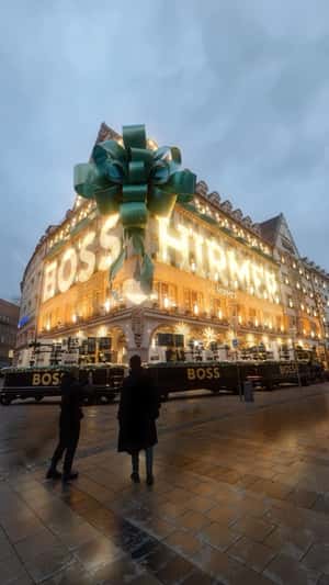Building Turned into Christmas Gift in a fake-out-of-home ad of HIRMER MENSTYLE