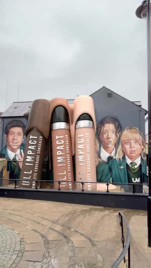 Concealers Over Flow from Massive Bottles in a fake-out-of-home ad of BPerfect Cosemetics