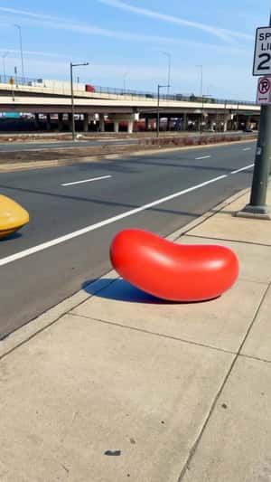Candies Burst Out of Billboard in a fake-out-of-home ad of Candy Crush