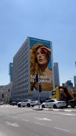 Building Wearing Sunglasses in a fake-out-of-home ad of Carolina Lemke