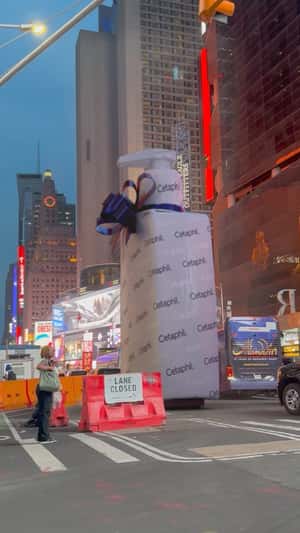 Wrapped Bottle Rolls at Times Square in a fake-out-of-home ad of Cetaphil