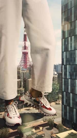 Giant in Sneakers on the Street in a fake-out-of-home ad of Christian Louboutin
