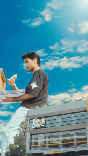 Pizza Box Lands on Rooftop in a fake-out-of-home ad of Chunk N Cheese