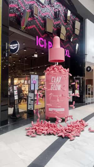 Serum on Wheels Drops Serum at Store in a fake-out-of-home ad of Clay and Glow