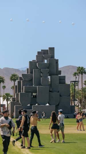 Rainbow Cylindrical Building Rotates in a fake-out-of-home ad of Coachella