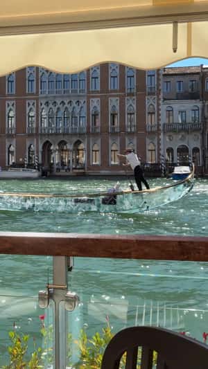 Glass Gondola on Venice Canal in a fake-out-of-home ad of The Luxury Collection