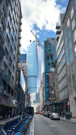 Crane Lowers Sunscreen onto the Street in a fake-out-of-home ad of Darling