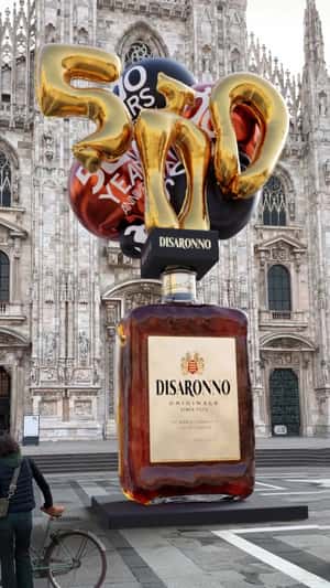 Balloon Floats from Wine Display in a fake-out-of-home ad of Disarrono