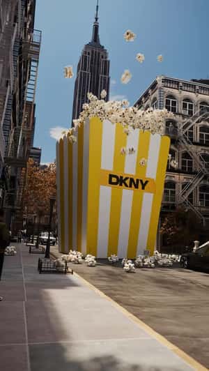 Popcorn Overflows on the Street in a fake-out-of-home ad of DKNY