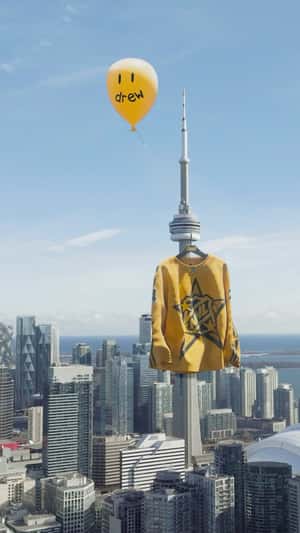 Sweatshirt Hangs from the Tower in a fake-out-of-home ad of Drew House
