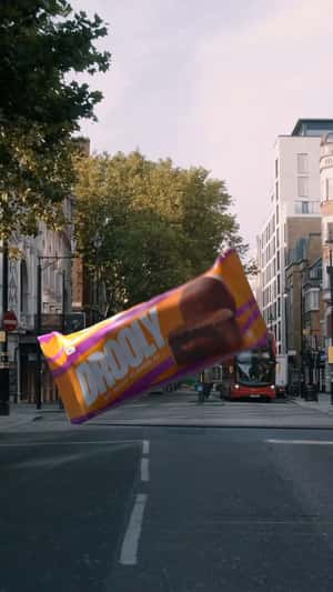 Chocolate Bar Lands on the Street in a fake-out-of-home ad of Drooly