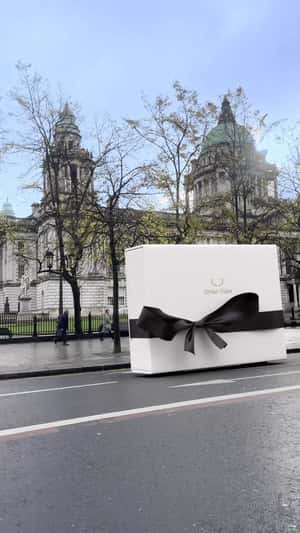 Gift Boxes Moving on Wheels in a fake-out-of-home ad of Dylan Oaks