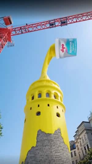 Crane Pours Paint on Tower in a fake-out-of-home ad of DYO