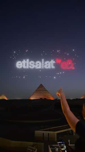 Drone Light Show at Pyramids of Giza in a fake-out-of-home ad of e& Egypt