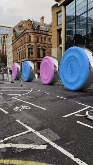 Rolling Shuffleboard Discs in a fake-out-of-home ad of Electric Shuffle