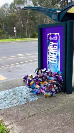 Energy Drink Cans Emerges from Ad in a fake-out-of-home ad of Elite Supps Australia