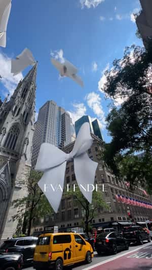 Butterfly Bows Perched on Buildings in a fake-out-of-home ad of Eva Lendel