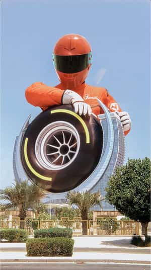 Racer Spins Wheel at Hotel in a fake-out-of-home ad of Fairmont Hotels & Resorts