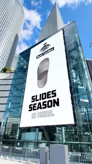 Sandals Burst Out from Digital Screen in a fake-out-of-home ad of Foot Locker