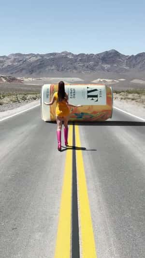 Woman Chasing Cocktail Can in a fake-out-of-home ad of Free AF