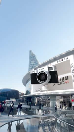 Camera Captures Shot from Facade in a fake-out-of-home ad of Fujifilm