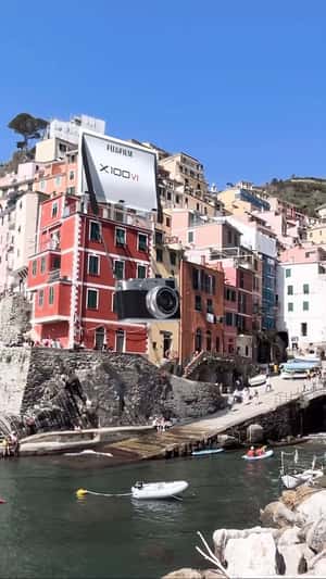 Camera Hangs from Building in a fake-out-of-home ad of Fujifilm