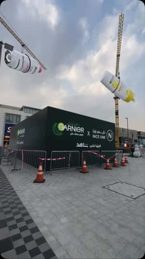 Skincare Products Suspended on Crane in a fake-out-of-home ad of Garnier