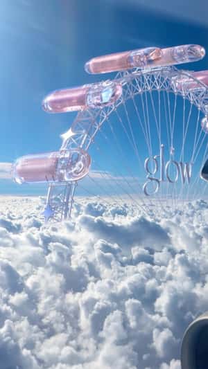 Eye Shadow Ferris Wheel in the Clouds in a fake-out-of-home ad of Glow