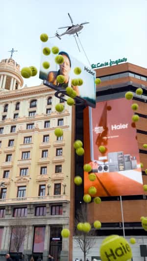 Helicopter Lifts TV Dropping Tennis Balls in a fake-out-of-home ad of Haier