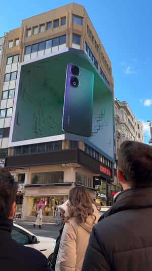 Basketball Emerges from Smartphone in a fake-out-of-home ad of Honor