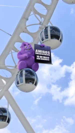 Blue Riding on Ferris Wheel in a fake-out-of-home ad of Paramount Pictures