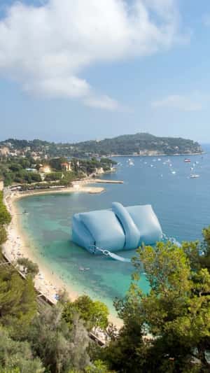 Inflatable Bag at the Beach in fake-out-of-home ad of Jacquemus