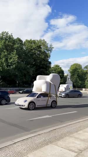 Cars Loaded with Armchairs in a fake-out-of-home ad of IWC Home