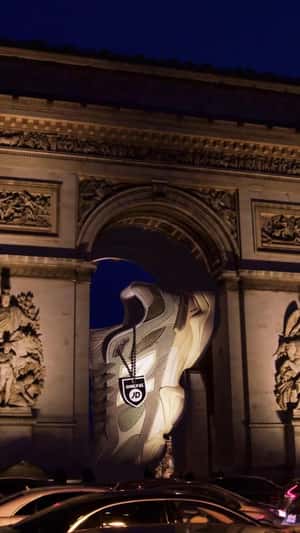 Sneaker Stuck on Arc de Triomphe in a fake-out-of-home ad of JD Sports