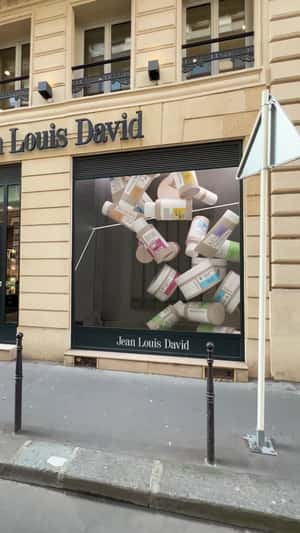 Products Overflow in the Window Display in a fake-out-of-home ad of JLD