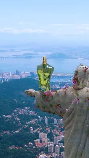 Flowers Bloom at Statue in a fake-out-of-home ad of Jean Paul Gaultier