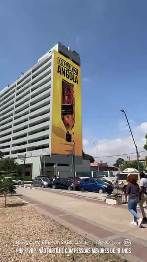 Whisky Bottle Emerges on Building in a fake-out-of-home ad of Johnnie Walker