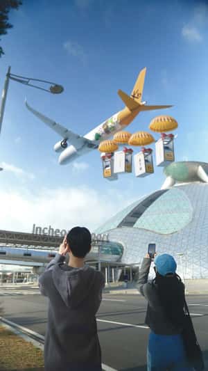 Plane Drops ATMs with Parachutes in a fake-out-of-home ad of Vogue