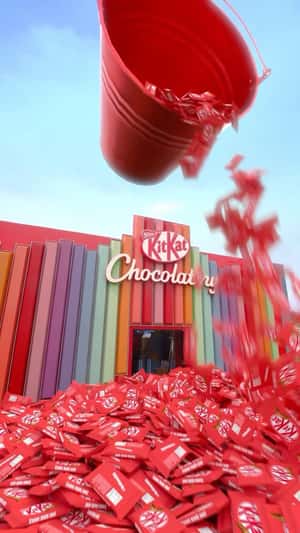 Bucket Pours Out Chocolate Bars in a fake-out-of-home ad of KitKat