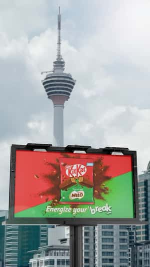 Billboard Burst by Soccer Ball in a fake-out-of-home ad of KitKat