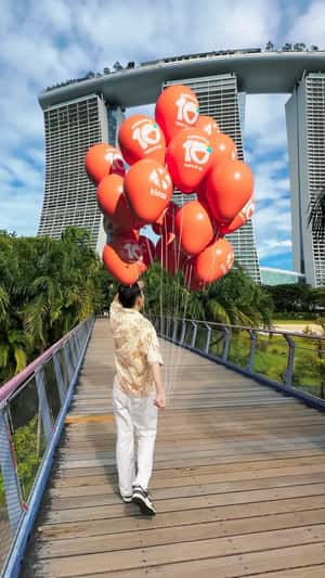 Plane Carries Banner Over Marina Bay Sands in a fake-out-of-home ad of Klook