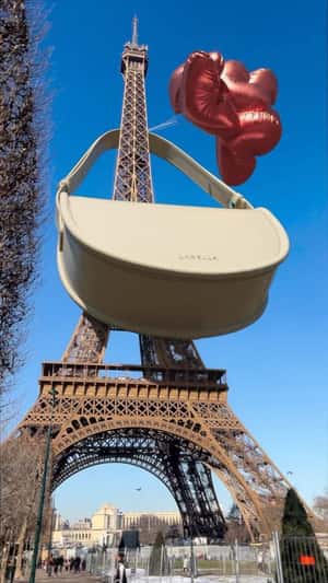 Eiffel Tower Wears a Handbag in a fake-out-of-home ad of Labella
